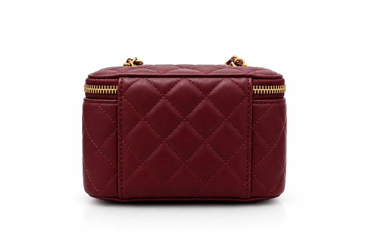 Chanel quilted black vanity case with gold-tone hardware
